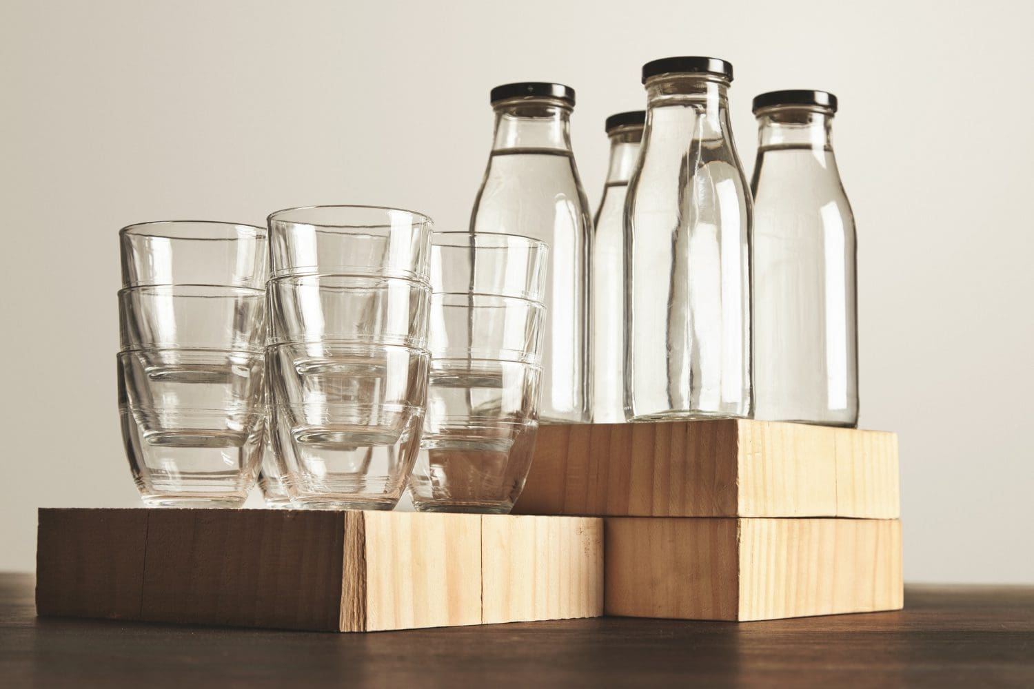 perfect-set-pure-clean-healthy-water-transparent-glass-bottles-cups-presented-wooden Glass Recycling
